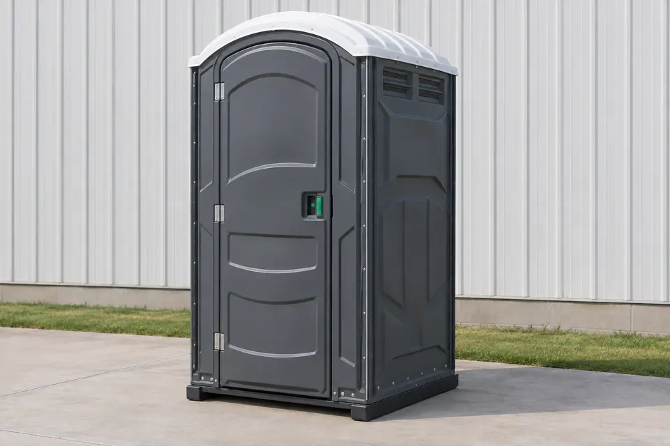 Standard portable toilet cabin on firm ground